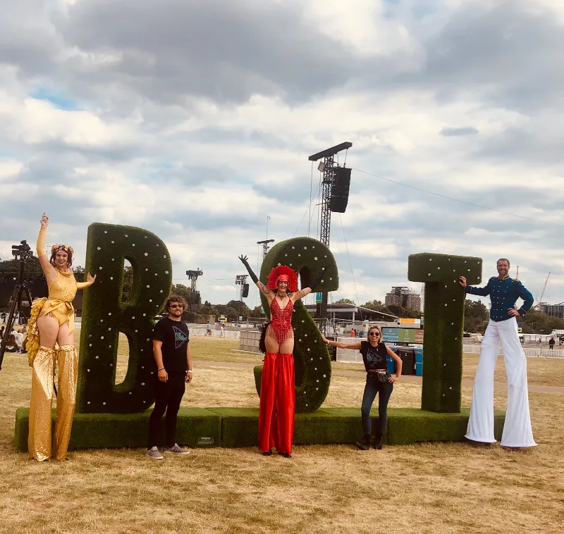 Stilt walkers by giant “BST” letters at BST Hyde Park