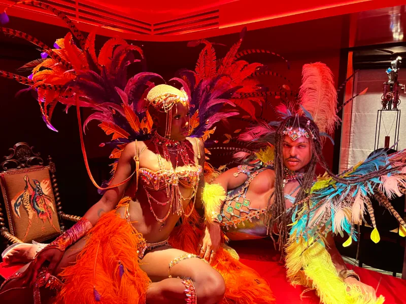 Carnival dancers in feathered headdresses