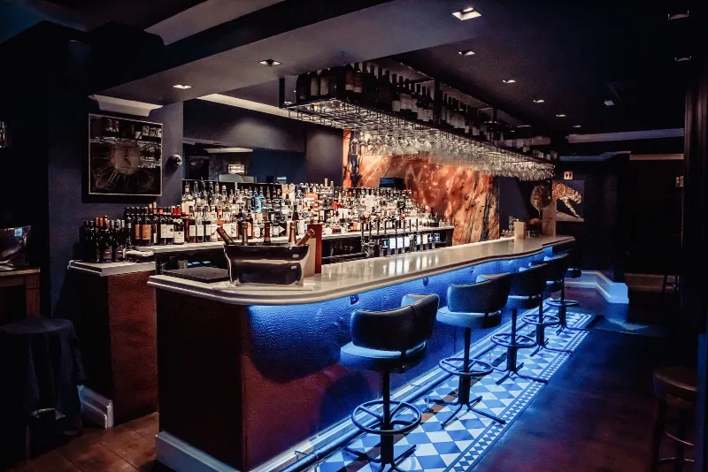 The bar at CuVée VIII, lit in blue