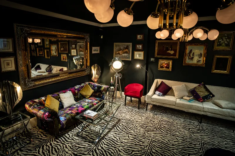 The lounge at CuVée VIII: chandeliers, a zebra rug and velvet sofas