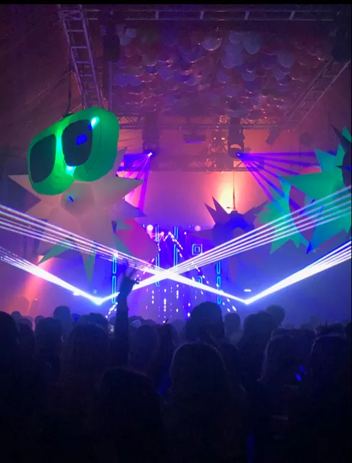 A laser show over a crowd