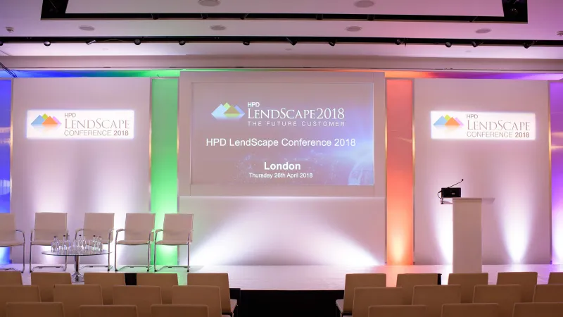 The HPD LendScape Conference 2018 stage, London: a white set with coloured uplights