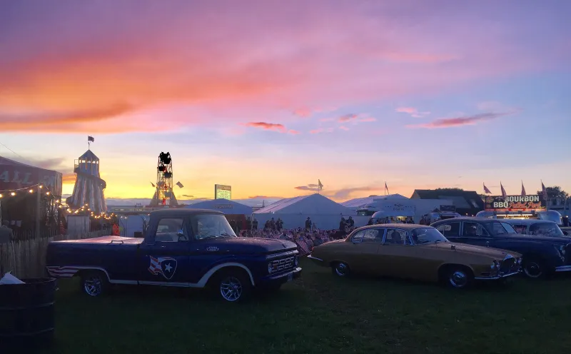 Vintage cars and the helter-skelter at sunset, Goodwood Revival