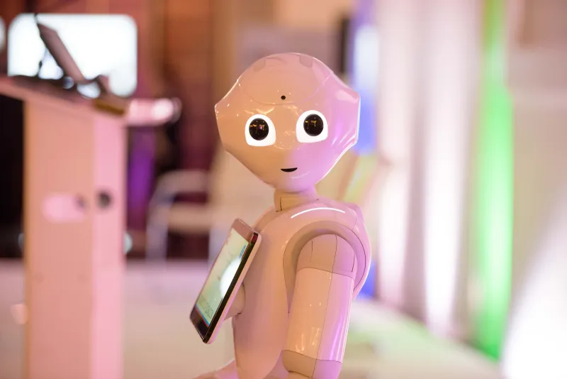A humanoid robot greeting guests