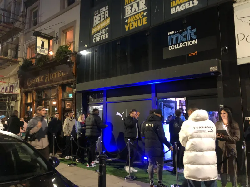 Crowds outside a size? store for the PUMA MCFC Collection launch